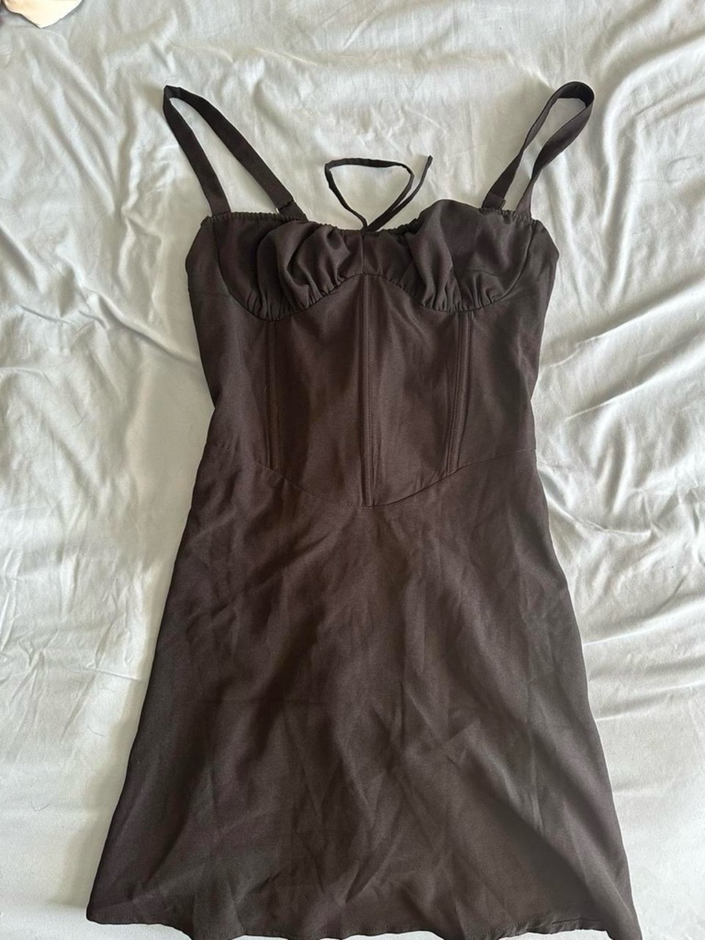 Black corset-style dress with lace up details